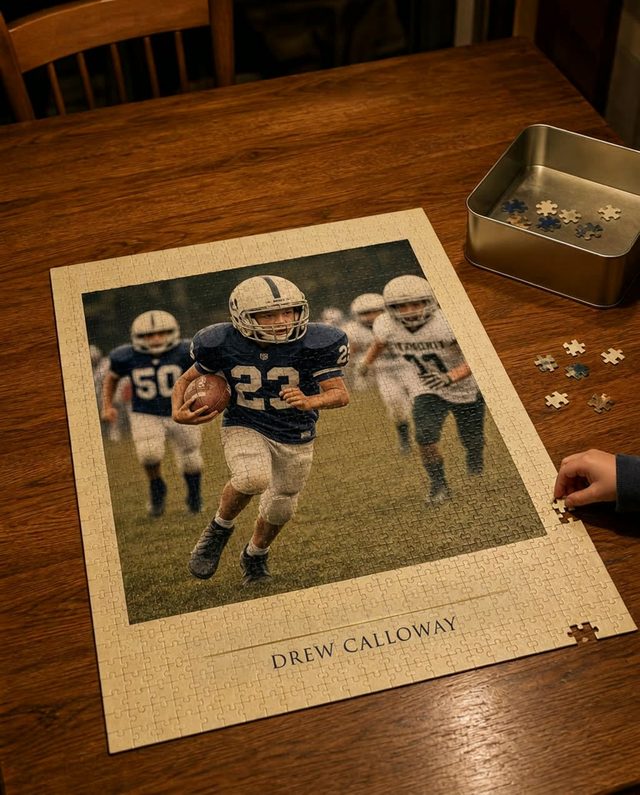 A GameYears puzzle of a youth football photograph, nearly finished on a kitchen table